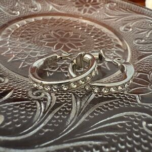 Vintage Monet Silver rhinestone clip earrings. In very good condition.